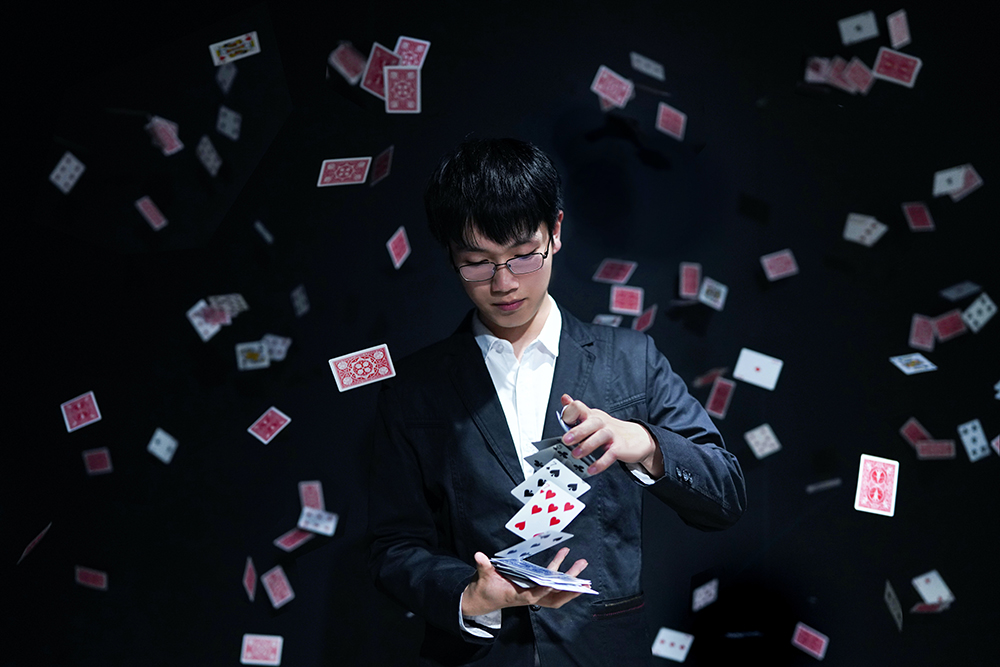 Magician deceiving the brain with a card trick